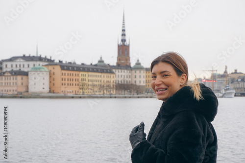 Photography A happy woman with a cityscape in the background