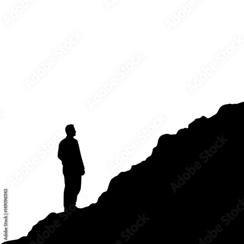 Silhouette of a man standing on rocky hillside against white background  