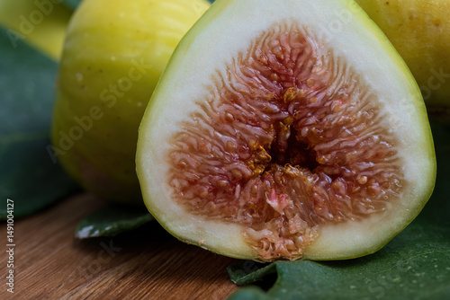 Closeup of fresh ripe fig fruit cut in half
