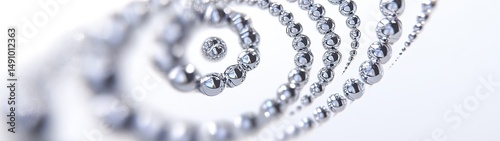 Abstract spiral of metallic spheres on white background.