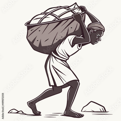 Laborer carrying heavy load on back while walking on rocky terrain  
