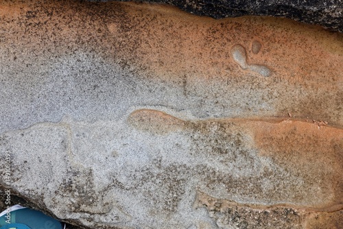 Natural sandstone texture with intricate layers, swirls, and patterns in warm earth tones. Perfect for backgrounds, design projects, geology, and nature-themed content.