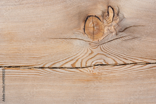 Wood texture of a board with a knot, background.