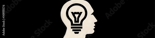 The Spark of Ingenuity: An iconic illustration of a human head silhouette, internally illuminated by a bright light bulb symbolizing inspiration, ideas, and creativity.