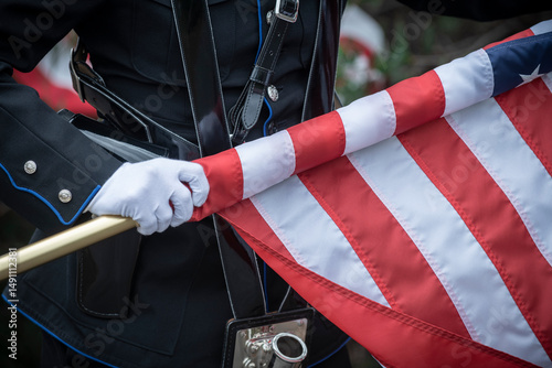 Color guard rolling up the US flag

