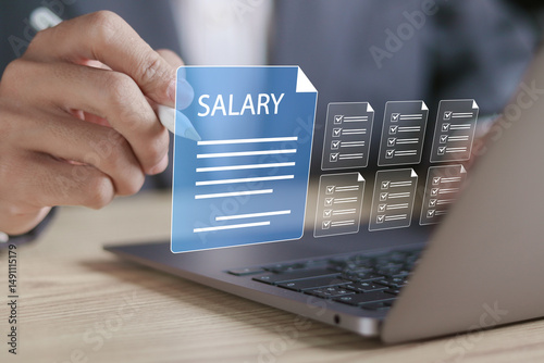 Fototapeta Naklejka Na Ścianę i Meble -  Salary payroll system, Payroll online payment concept, employee wages. Businessman working on payroll management with digital salary document on virtual screen.