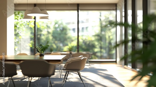 A blurry photo of an empty, modern office.  The interior features chairs, a table, and large windows with bright, bokeh-style light. Ideal for design backgrounds.
 
