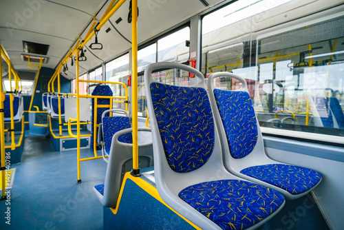 Empty bus interior. Seats without passengers. Public transport.