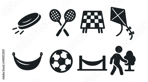 Solid style icons of outdoor leisure: frisbee, badminton rackets, picnic blanket, flying kite, hammock icon, mini football, slackline, nature walk.
