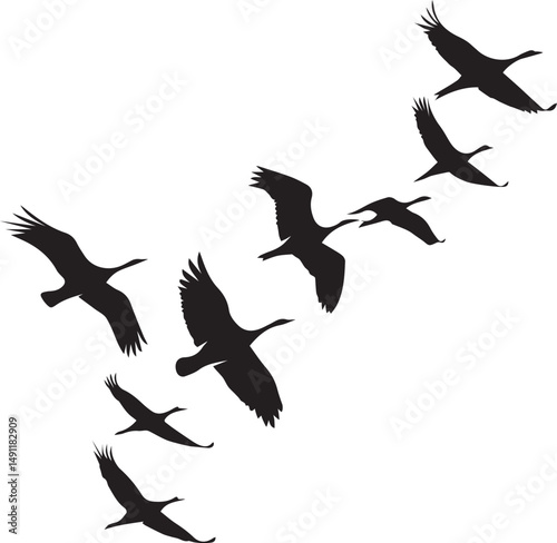 Silhouette of a flock of cranes in flight diagonal formation against a white background