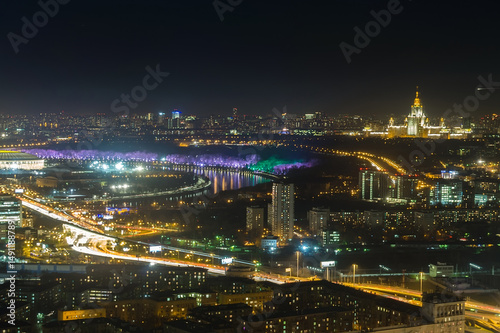 Wallpaper Mural A breathtaking panorama of Moscow at night highlights the city's illuminated skyline. Vibrant colors reflect on the river, while buildings and streets radiate life and energy. Torontodigital.ca
