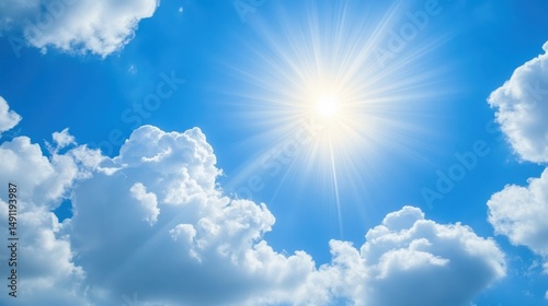 Bright Sunburst Over Clear Blue Sky with Fluffy White Clouds