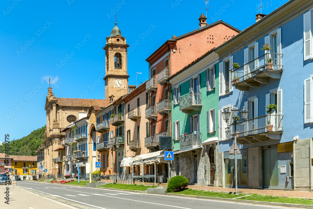 Obraz premium A vibrant street scene and colorful buildings in Corneliano d'Alba, Piedmont, Italy.