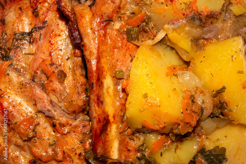 Baked pork ribs with potatoes.Pork ribs with spices.Pork ribs background.Pork rib kebab.