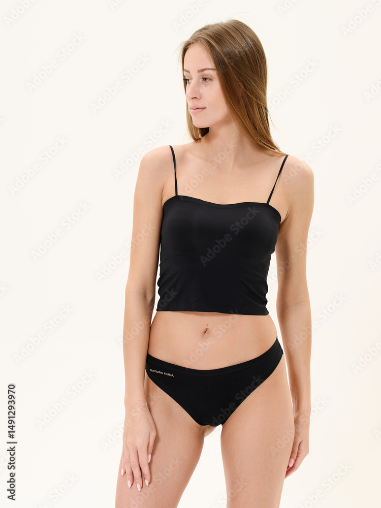 Obraz premium Girl in lingerie in studio on white background