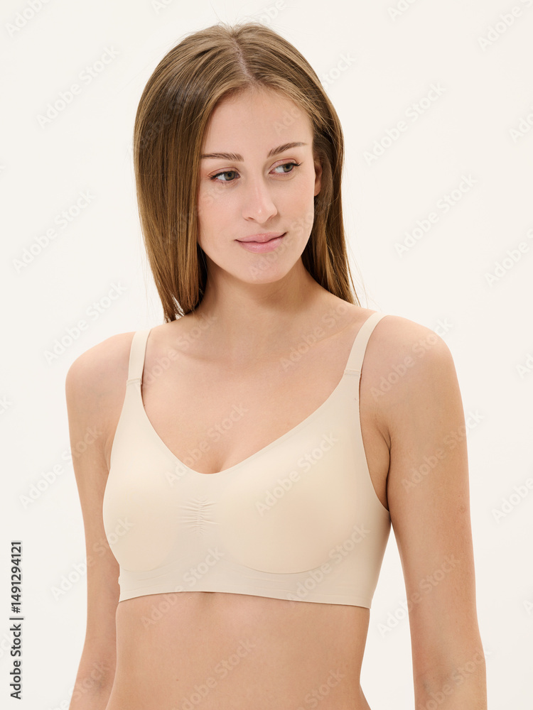 Fototapeta premium Girl in lingerie in studio on white background