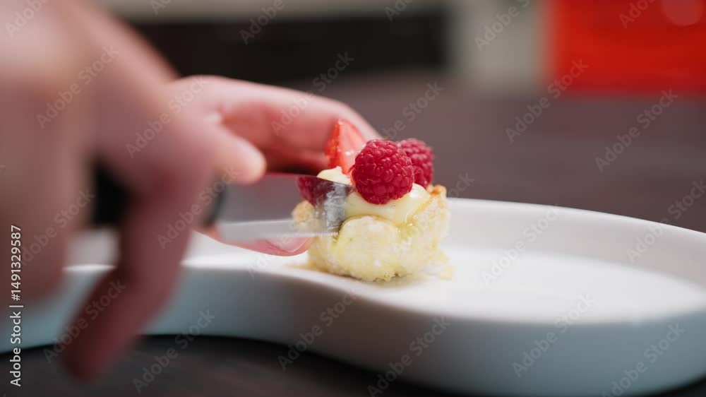 Woman Cuts Half Pastry At Table For Diet Controlled Snack