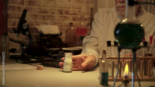 vintage doctor or scientist using a scale to measure chemicals