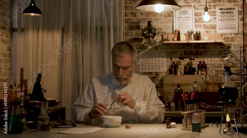 doctor using mortar and pestle to mix medicine