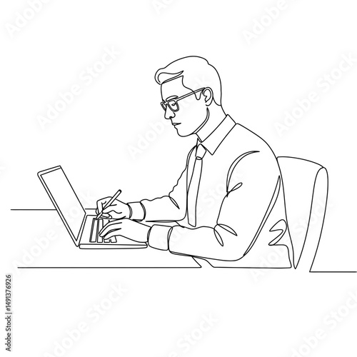 Young man working on laptop while writing in office setting  