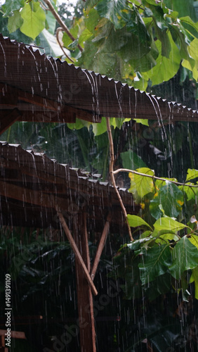 Heavy rain poured down, rainwater flowed from the roof of the house