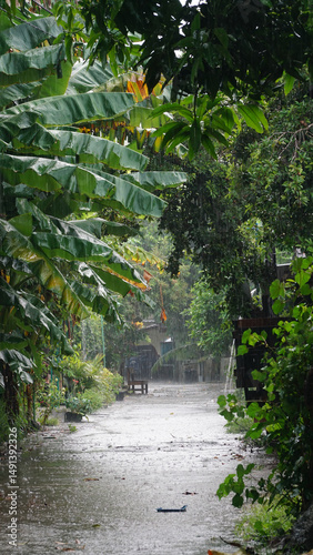 Heavy rain poured down and flooded the village streets.