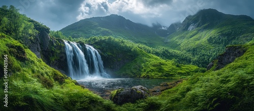 Majestic Waterfall in Lush Green Mountains