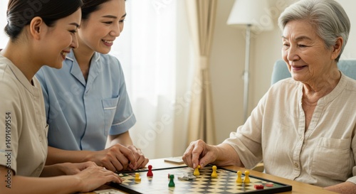 Elderly woman playing checkers with caregivers in nursing home for recreation therapy