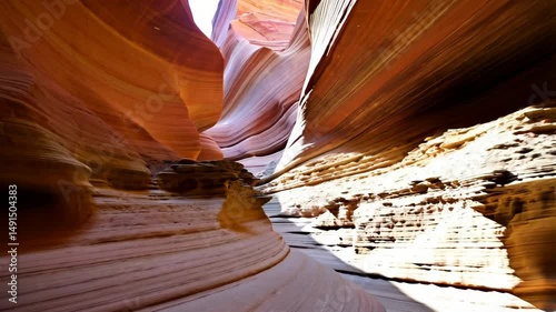 Spectacular sandstone slot canyon with layered textures and shadows creating a natural scenic formation.