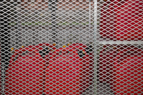 Security Grid Protecting Red Gas Tanks Behind Fence