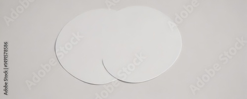Close-up of single paper circle with a pronounced drop shadow, isolated on white,  drop shadow,  macro