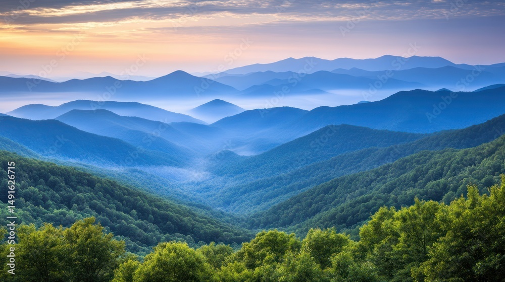 Obraz premium Misty mountain range at sunrise