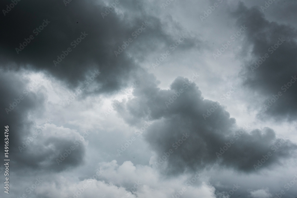 Fototapeta premium Dramatic dark storm thundercloud rain clouds on black sky background. Dark thunderstorm clouds rainny landscape. Meteorology danger windstorm disaster climate. Dark cloudscape storm disaster gray sky
