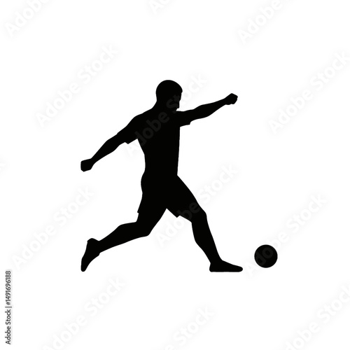 Soccer Player Kicking a Ball in Silhouette