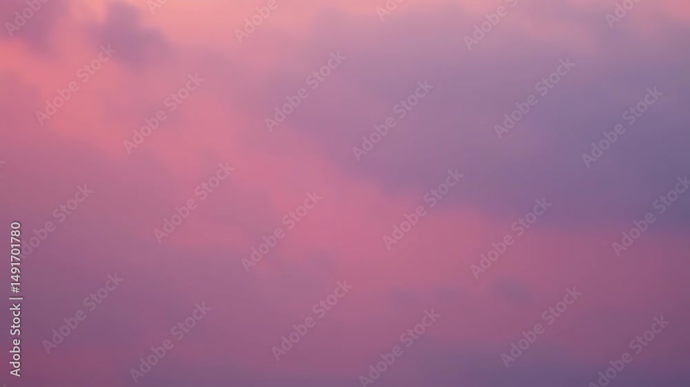 Pink sky with soft clouds in a dreamy natural atmosphere