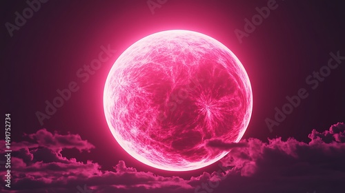 Pink luminous moon over dark clouds