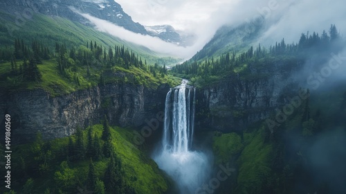 Majestic waterfall cascading down mountainside, misty alpine valley background; travel poster