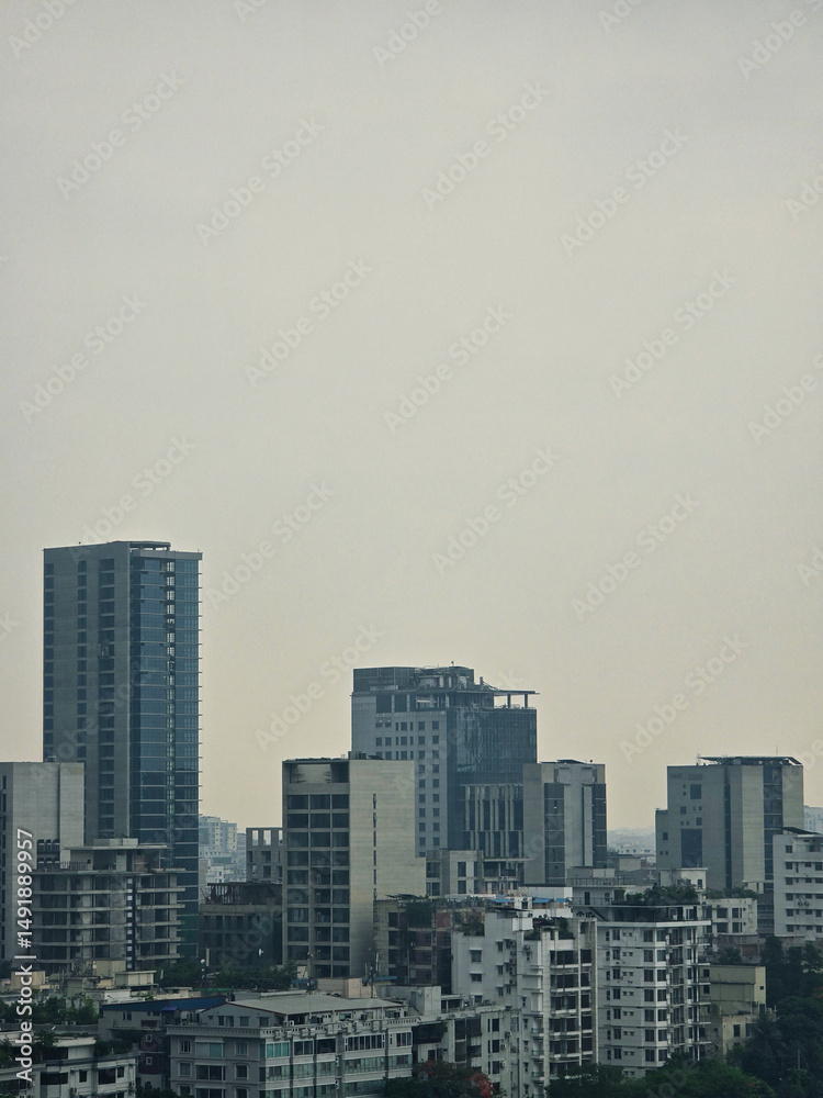 Obraz premium High angle view of Dhaka city residential and financial buildings at evening. cityscapes of Dhaka with vibrant color. Beautiful aerial drone shot of evening over Dhaka, Bangladesh.