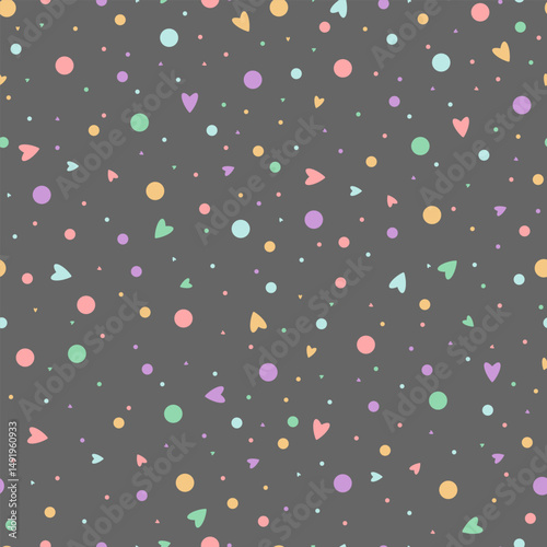 A delicate seamless pattern with bed hearts, circles and small elements scattered on a dark gray background. It is ideal for children's goods, wrapping paper, textiles, postcards, wallpaper, design fo