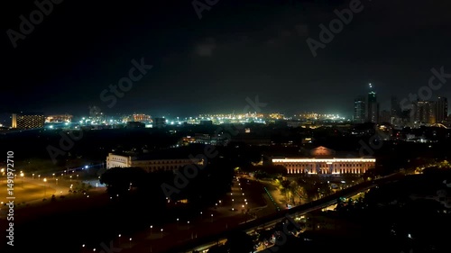 Wallpaper Mural Aerial view of capital city of Manila Philippines at night during thunder and lightning storm with lit up skyline Torontodigital.ca