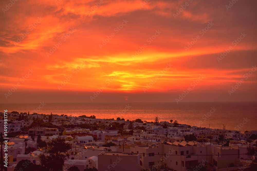 Fototapeta premium Sunrise over city, Santorini, Greece