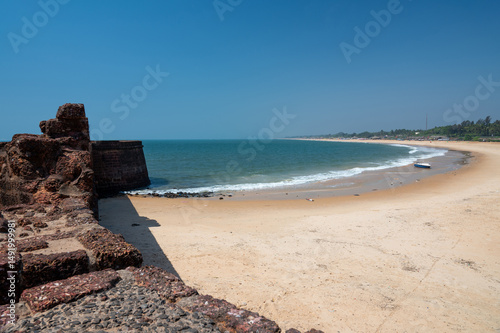 Fort Aguada ramparts and Sinquerim Beach of Goa, South India, monument at arabian sea, travel destination asia photo