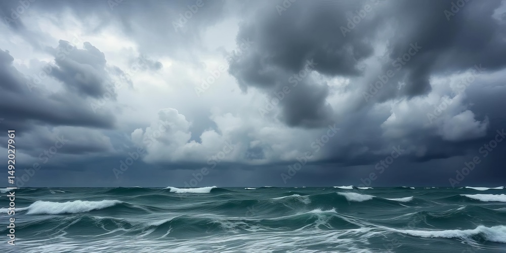 Fototapeta premium Dark, brooding storm clouds dominate a turbulent ocean scene, dramatic, waves