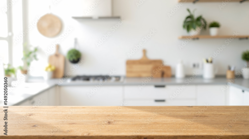 Fototapeta premium Rustic wooden table in bright kitchen environment, showcasing objects, food styling, or workspace. Contemporary room with white cabinets and natural decor elements creating cozy atmosphere