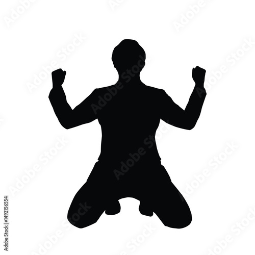 A man silhouette kneeling with raised fists, expressing victory, celebration, or emotional triumph