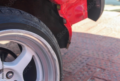 Damaged wheel rim on a tuner car