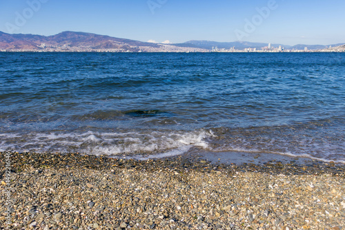 Fototapeta Naklejka Na Ścianę i Meble -  view of small foaming waves on the coastline in Izmir Park in Turkey