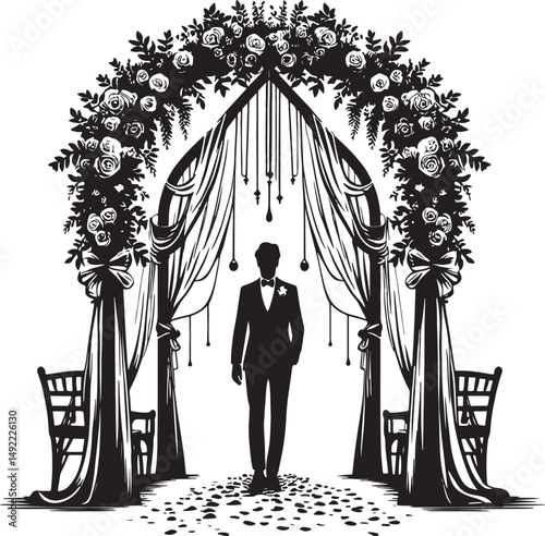 A groom stands beneath a floral archway at a wedding ceremony in black and white
