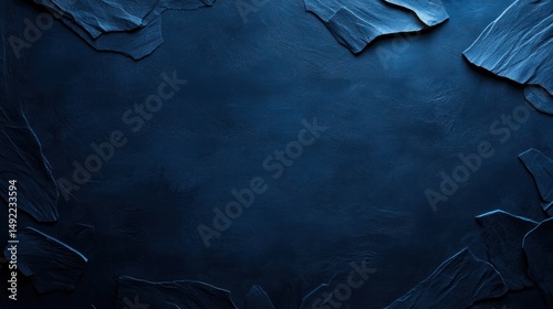 Obraz na płótnie Dark blue textured background with irregular stone-like shapes forming a border w salonie