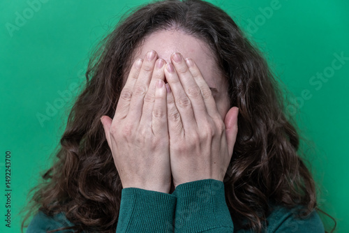 Photos Woman Covering Face with Hands Expressing Fear, Shame and Insecurity